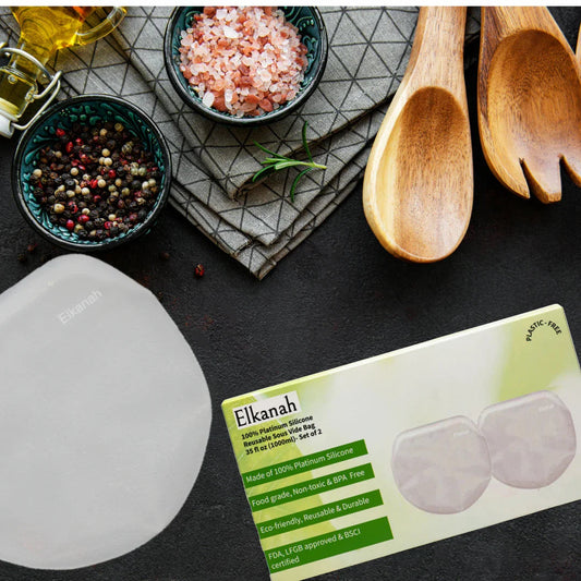 Elkanah silicone sous vide bag box on kitchen counter with spice bowls, oil, and wooden utensils